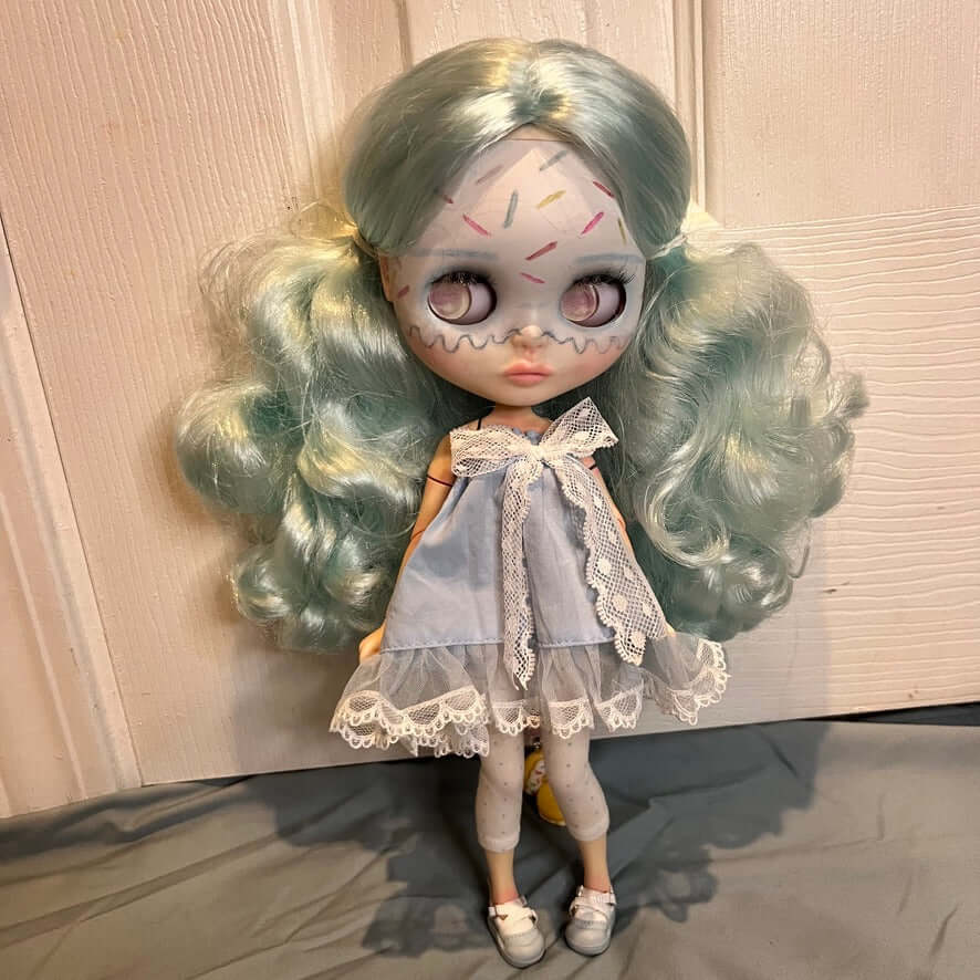 custom blythe doll with ice cream makeup, cotton candy hair and a blue dress