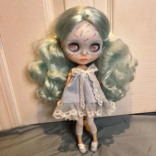 custom blythe doll with ice cream makeup, cotton candy hair and a blue dress